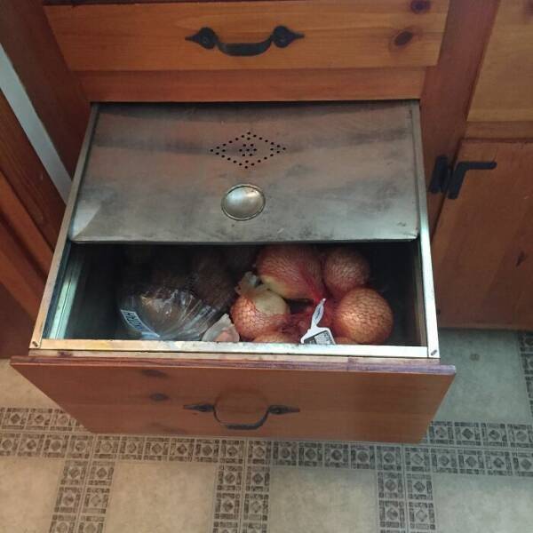 1959 kitchen equipped with a metal drawer for potatoes and onions.jpg