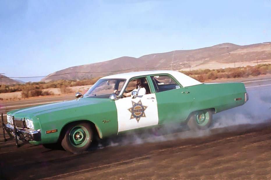 1973.Plymouth.Fury.I.4dr.Police.Car.Skidding.jpg