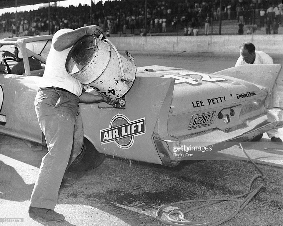 76-1960-lee-petty%E2%80%99s-plymouth-is-refueled-on-a-pit-stop-during-the-rebel-300-nascar-jpg.jpg