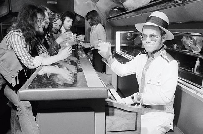 elton-john-plane-1974-billboard.jpg