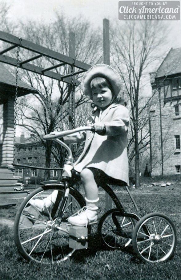 vintage-tricycle-girl-outside-blocks.jpg